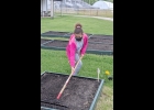 Layla Scarlett a member of the Grove Progressive 4-H Club tills her garden plot to make ready for her vegetable garden planting, she and her brother Linca did on May 21.