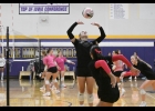 Bulldog Regan Eastvold sets the ball with both Ari Stensrud and Afton Dean ready to attack the ball.