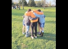 Coach Einertson pictured with Northwood-Kensett 2023 cross country team.
