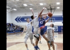 Viking Kyle Nichols takes it strong to the hoop in last Friday’s 69-33 loss in Rockford. Nichols played in his final game of the season on Monday night against North Union because of a scheduled surgery on his hand. 
