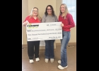 Erica Bill (middle), Customer Support Specialist, presents Farmers New Ag’s contribution to decrease the cost of 4-H dues to Teresa Butler (left), Worth County Extension and Outreach Youth Coordinator, and Emma Wagner, Worth County Extension and Outreach Office Manager.