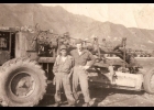 Standing in front of caterpillar are Papa San - Ernie's house boy, an old man at 44 years old and Ernie.