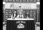 Reagan Ham (seated at center) is joined by her mother Sarah Ham, father Jaime Ham, and younger brother Carter Ham. Photo - J.L. Photography