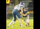 Bulldog Berkley Dean works to tackle the AGWSR ball carrier during Friday night's homecoming game.  Photo courtesy of Chet Yost.