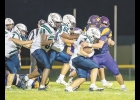 Bulldog Leif Rogne wraps up the Belmond-Klemme ball carrier during Thursday night's game in Lake Mills.
