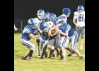 The Northwood-Kensett Vikings defense works together to take down the Cougar ball carrier during Friday night's game.