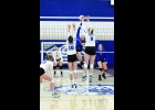 N-K’s Peyton Pangburn blasts a shot through the Lady Warriors defense in last Tuesday’s 3-1 (25-27, 25-22, 25-16, 25-14) win in Rockford. Pangburn had four kills, four digs and was 16-17 at the service line.