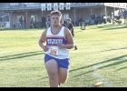 Viking Ayden Clark runs along the trail during Thursday’s meet in Manly at Pioneer Golf & Country Club.